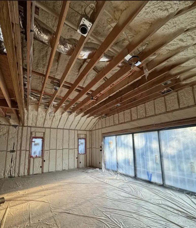 Interior walls and ceiling insulated with spray foam during new construction in Hyrum